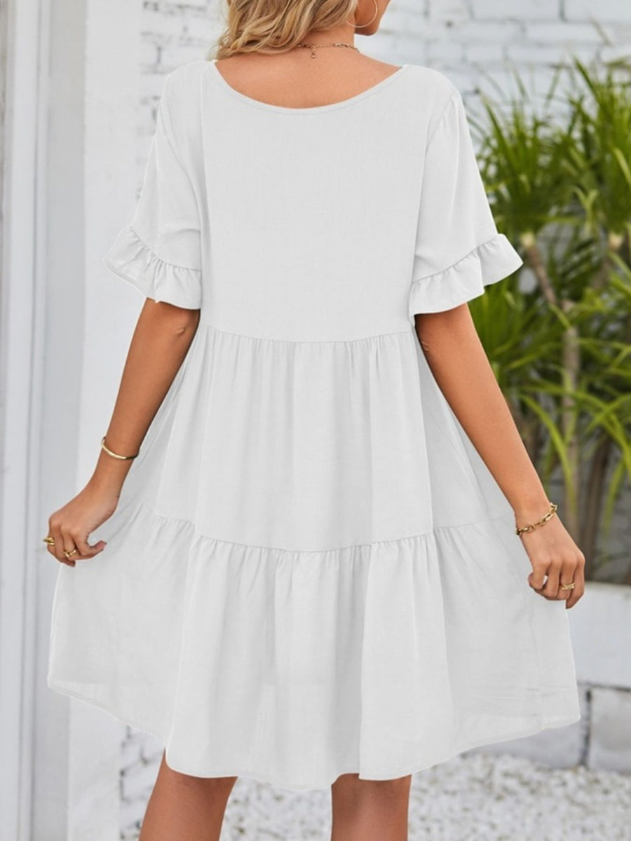 White ruffled sleeve mini dress with tiered skirt and pockets