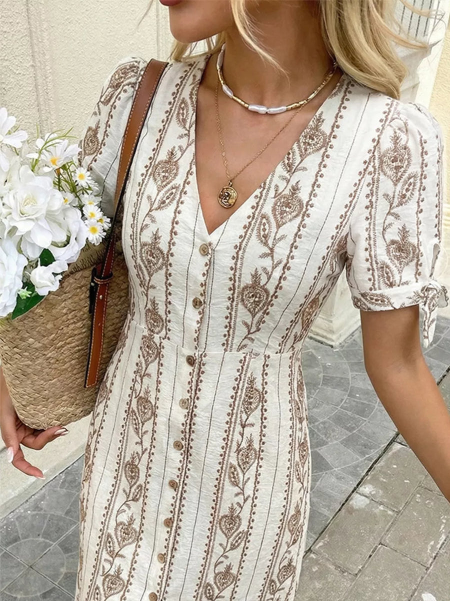 Printed button-down midi dress with v-neck, short sleeves, and a-line cut.