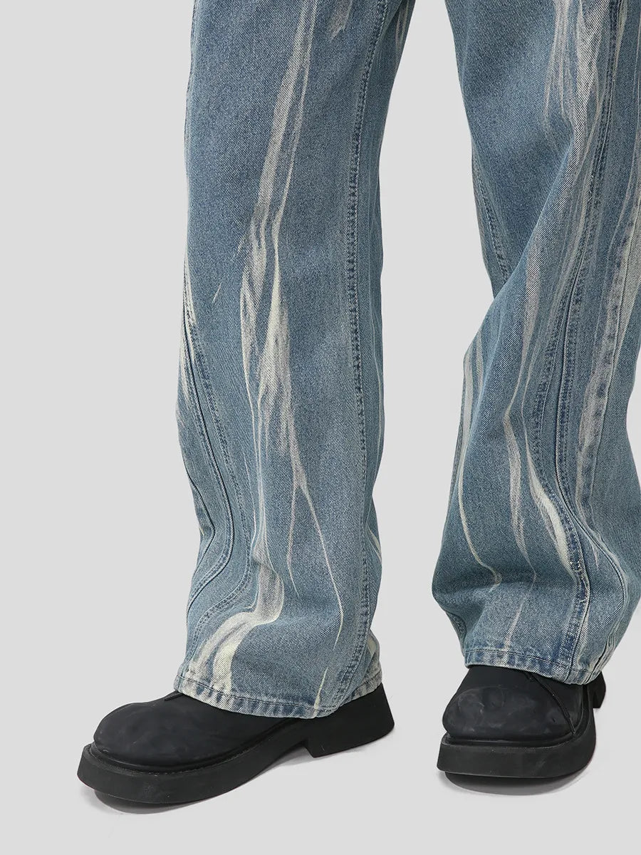 Bleached wash wide leg denim jeans with a distressed pattern and casual fit.
