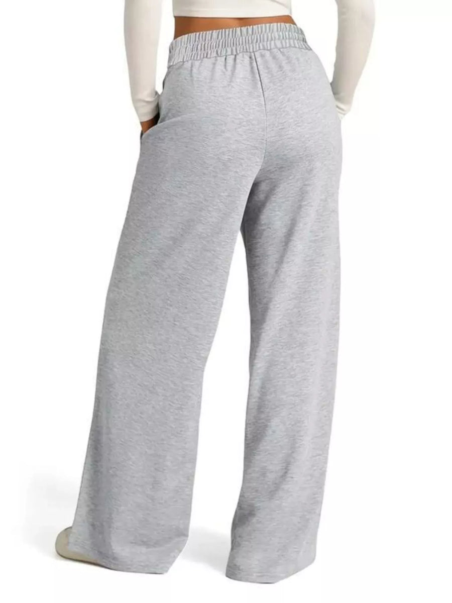Light gray wide-leg lounge pants with drawstring waist and pockets