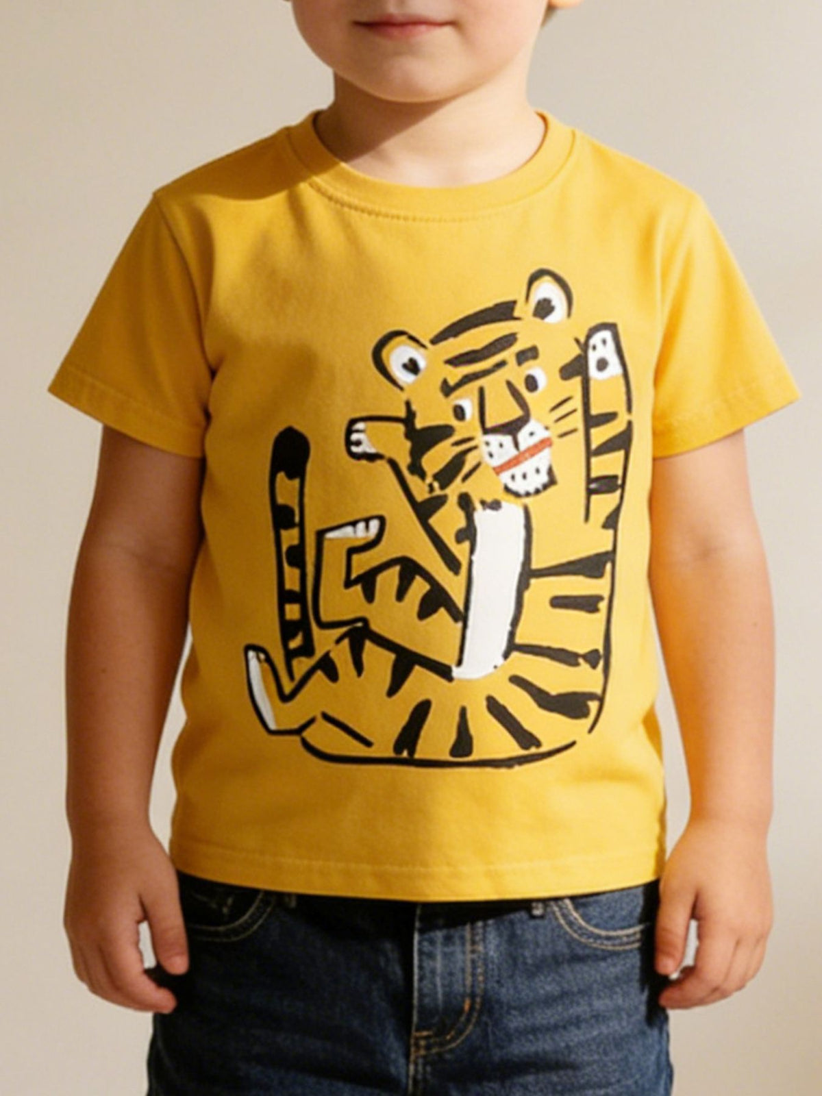 Yellow cotton crew neck t-shirt with a playful tiger graphic for toddlers.