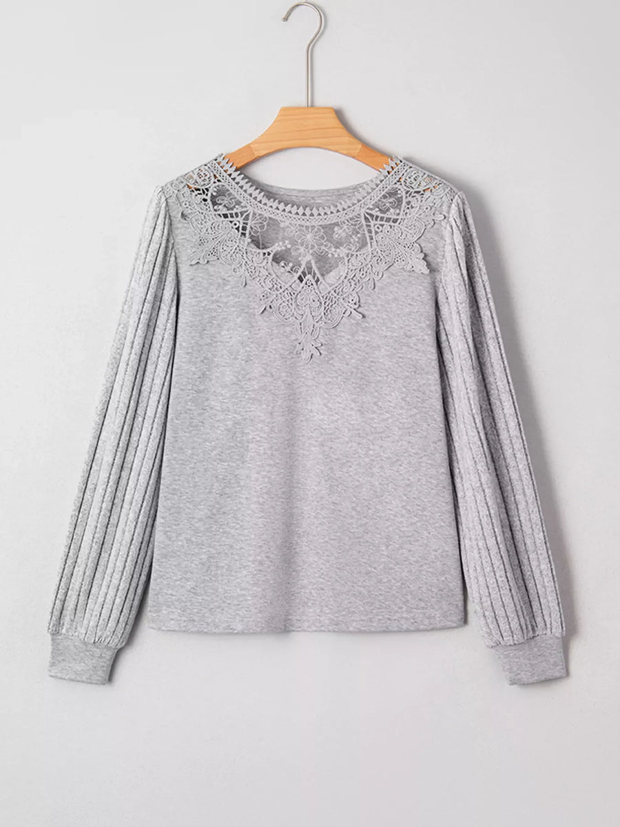 Gray ribbed knit long-sleeve top with intricate lace yoke detail