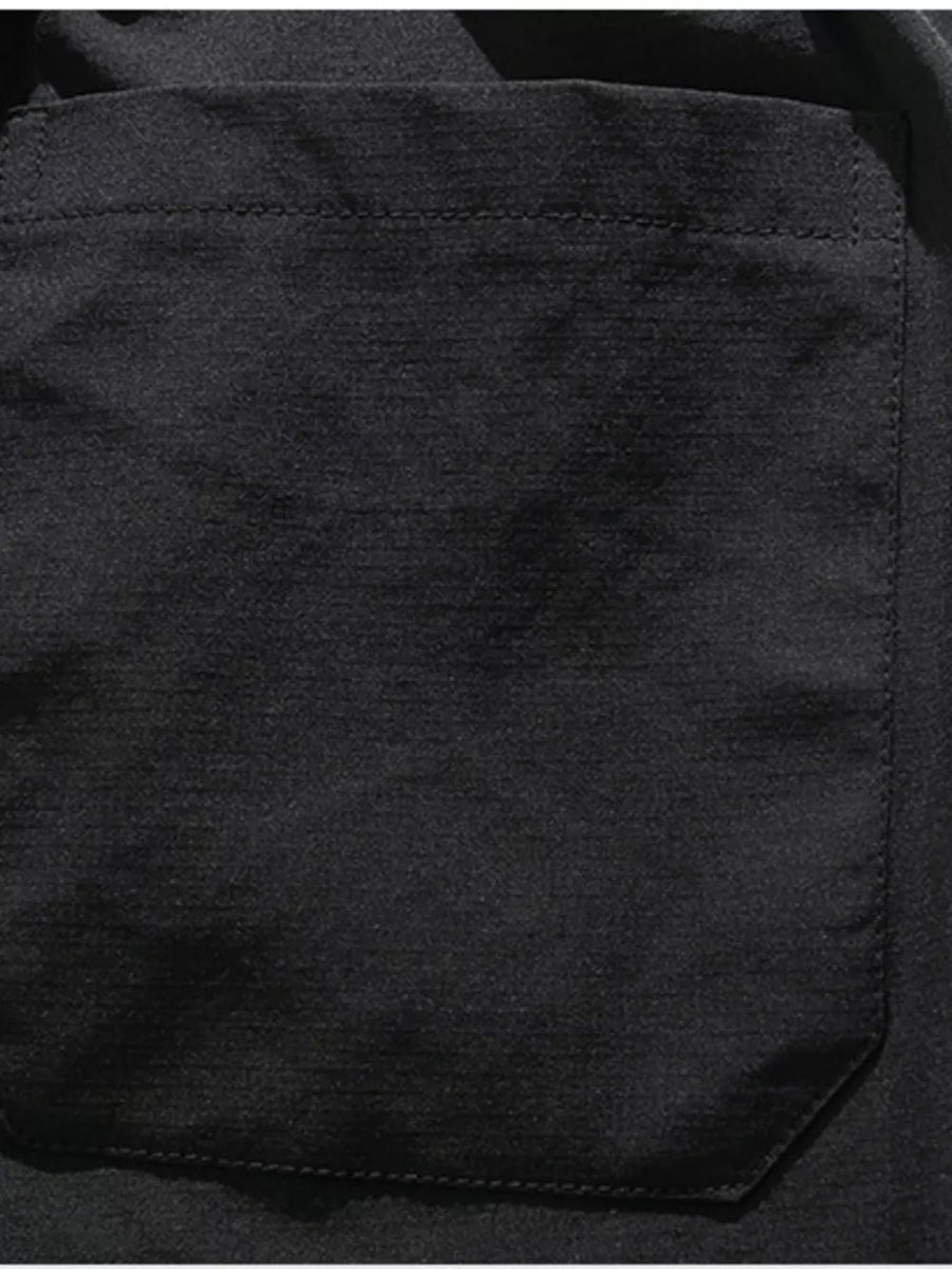 Black cargo capris with a patch pocket and visible stitching detail.