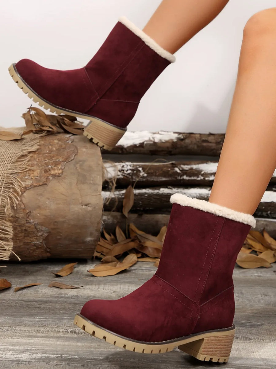 Burgundy suede ankle boots with sherpa trim and lug sole.