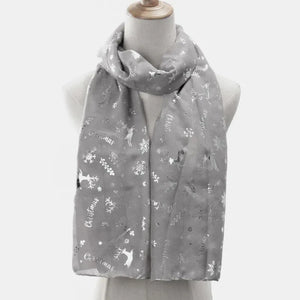Light gray scarf with metallic Christmas print featuring reindeer and snowflakes.