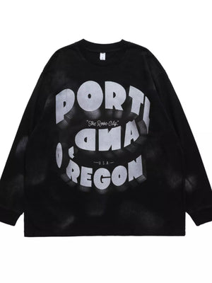 Black oversized long-sleeve t-shirt with bold white "PORTLAND OREGON" graphic and "The Rose City" text.