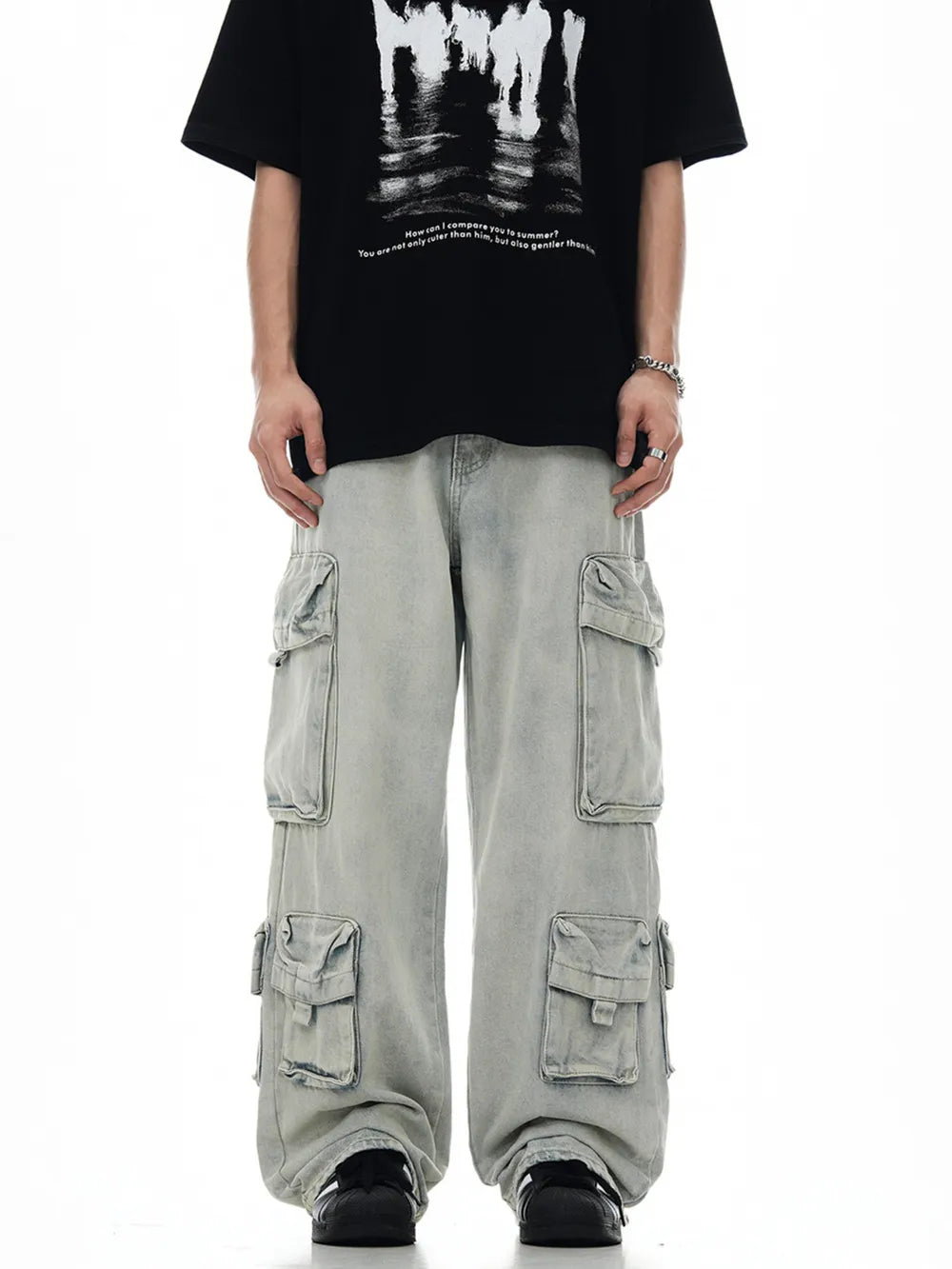 Relaxed fit light blue denim cargo trousers with multiple pockets.