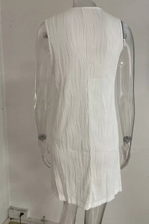 White textured mini dress with V-neck and ring straps, cotton blend fabric.