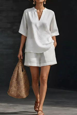 White notched v-neck top and pocketed shorts set, comfortable loungewear for women.