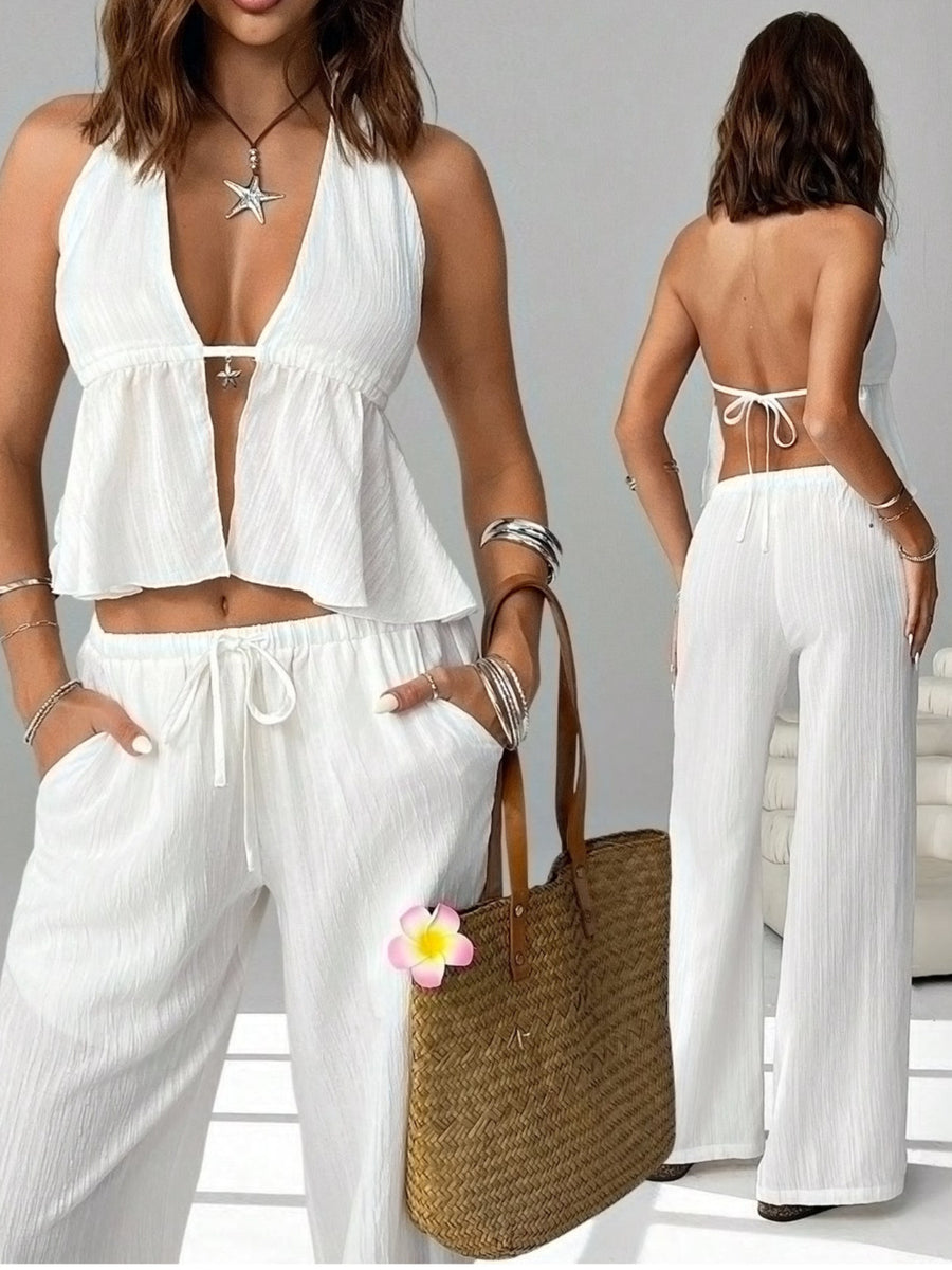 White halter neck cami and relaxed drawstring pants set with a deep V-neck and tie back.