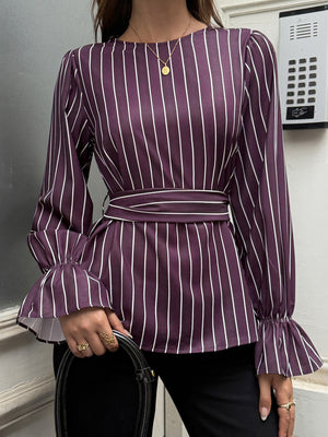 Purple blouse featuring tied waist and striped
