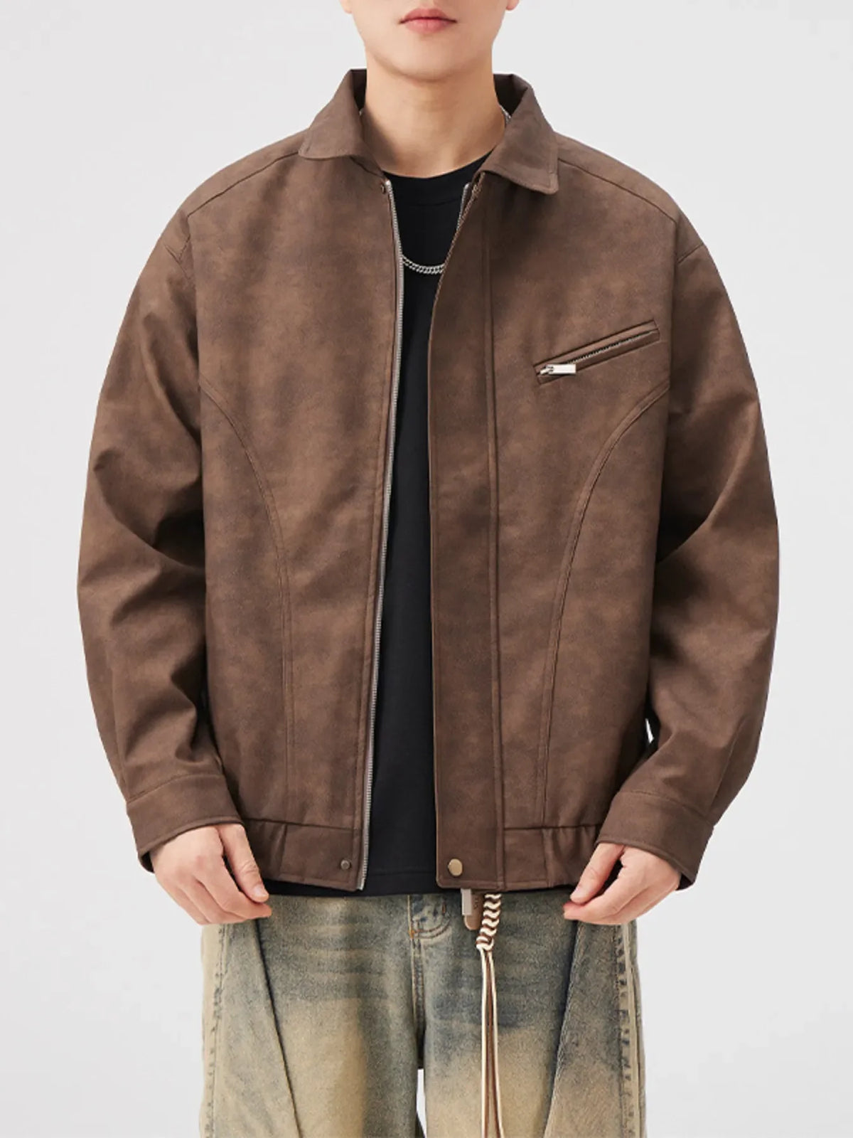 Brown vintage zip up leather jacket with chest zipper detail and collar.