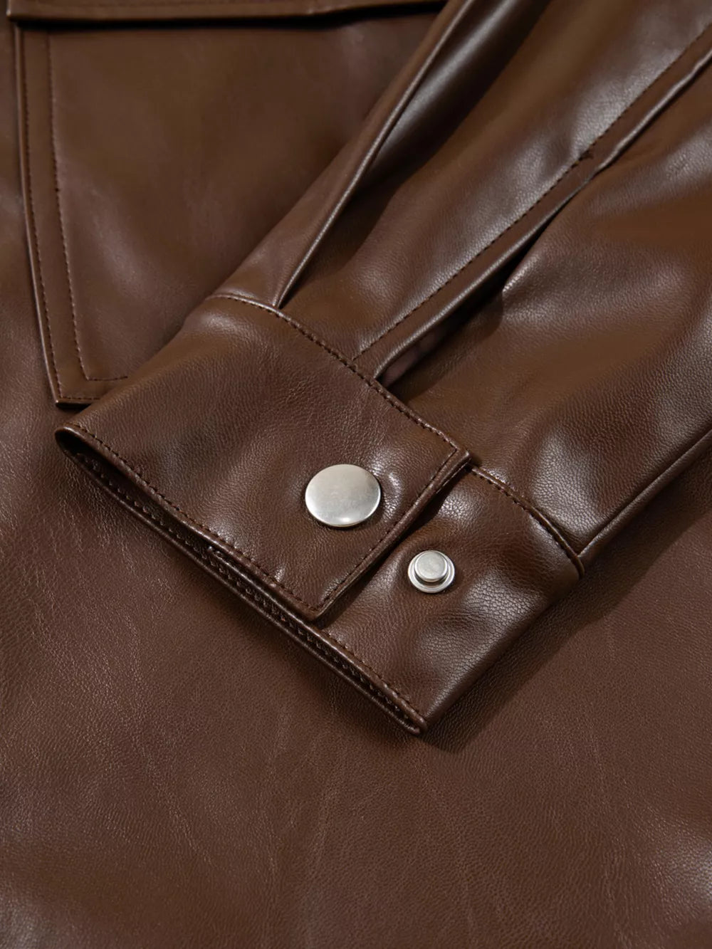 shell:100% PU Lining: 100% polyester Care instructions: Machine wash cold leather jacket in chocolate brown with relaxed
