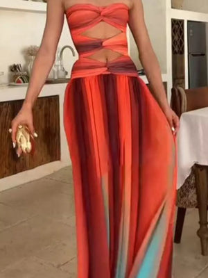 Strapless ombre maxi dress with twisted bodice cutouts and flowing skirt.
