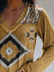 Yellow geometric print V-neck long sleeve t-shirt with tribal pattern detail.