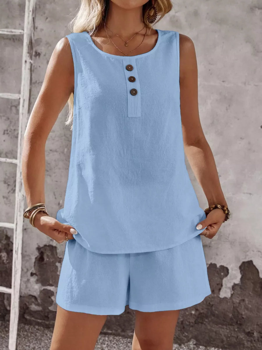 Sky blue cotton two-piece set with decorative buttons on the sleeveless top and matching shorts.