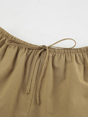 Khaki cotton shorts set with elastic waistband and drawstring detail.