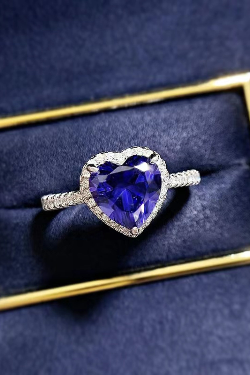 Blue heart halo engagement ring with diamond band