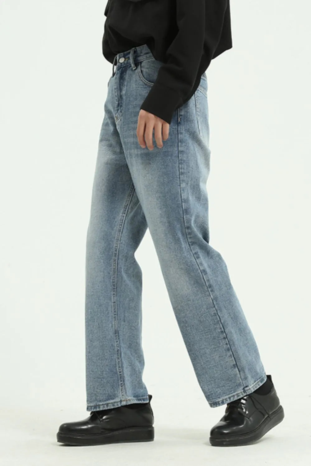 Light blue denim jeans with a wide-leg cut and a casual, relaxed fit.