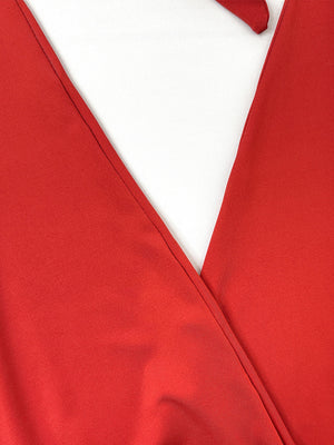 Red wrap dress with V-neckline and subtle texture