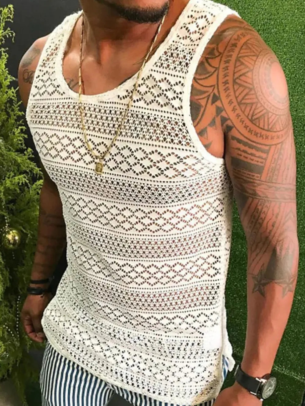 Ivory crochet tank top with geometric pattern and scoop neck.