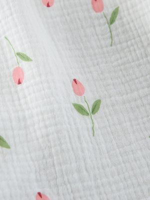 Floral print cotton robe with pink blooms and green leaves on white gauze fabric.