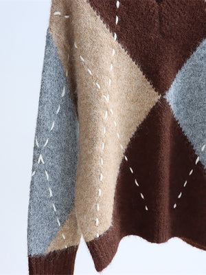 100% polyester Care instructions: Machine wash cold v-neck sweater in beige with oversized silhouette