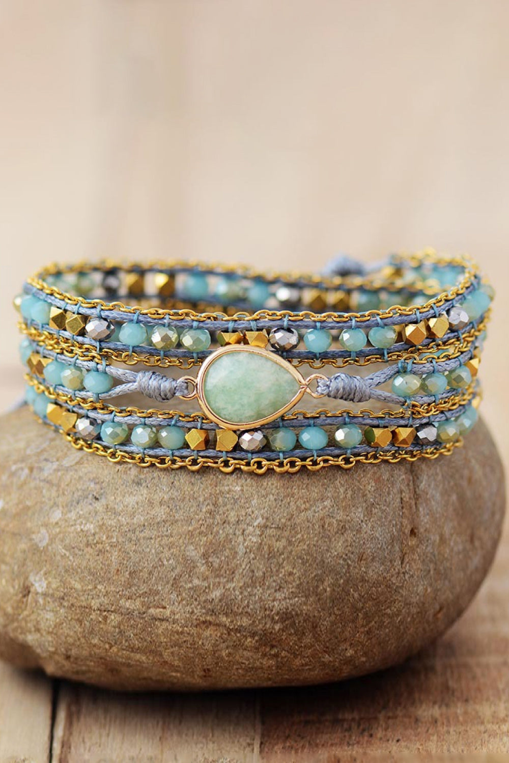 Aqua beaded wrap bracelet with gold chain and teardrop gemstone detail
