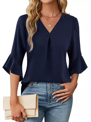 Navy V-neck blouse with ruffle sleeves and a subtle textured fabric.