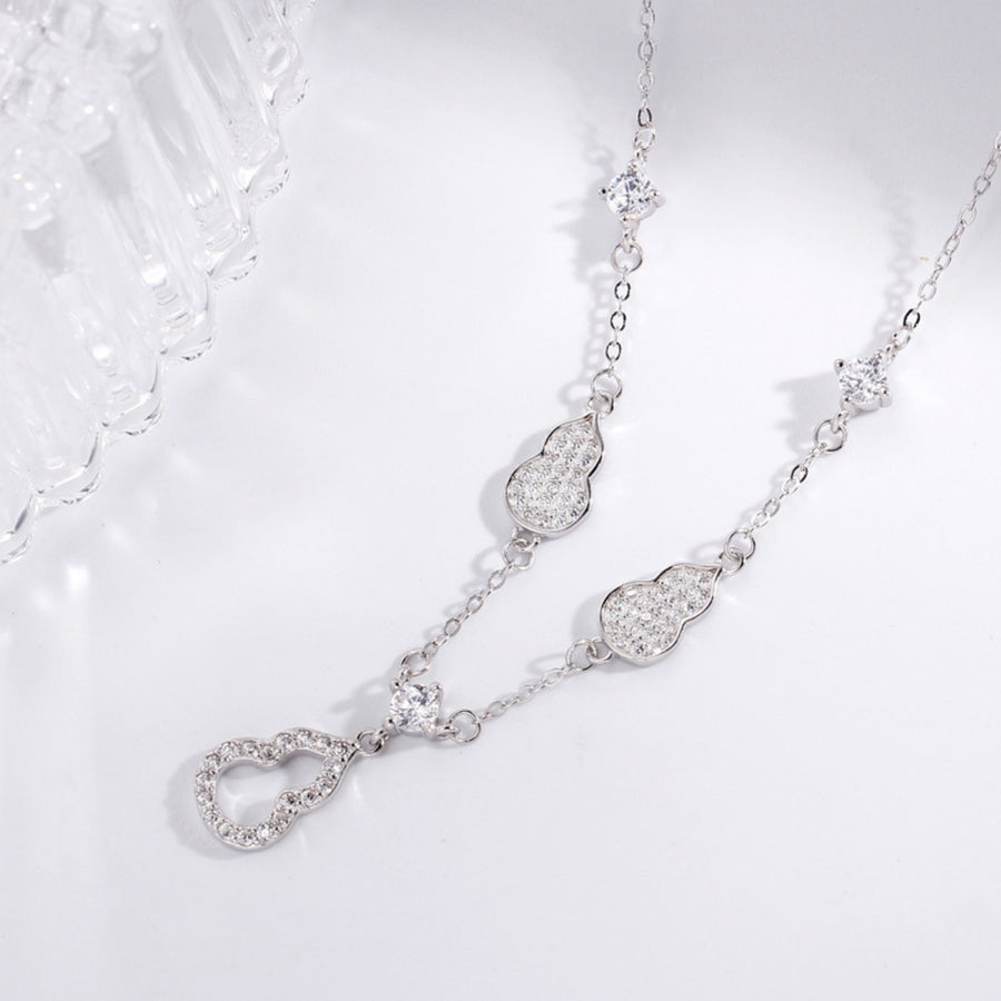Silver Y-lariat necklace with zircon-adorned gourd charms and square crystals