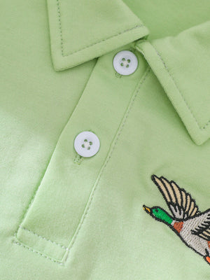 Light green cotton polo shirt with embroidered duck detail and white buttons