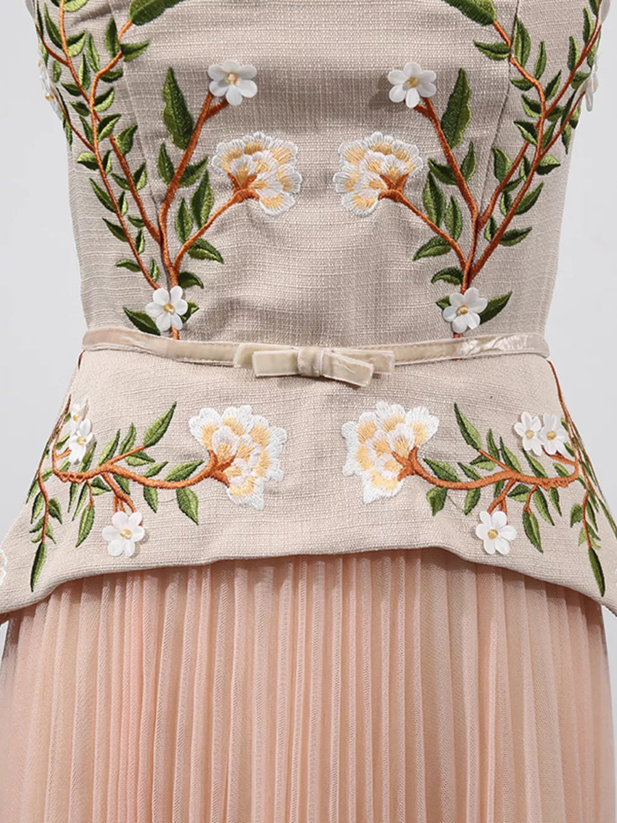 Embroidered midi dress with floral detail, velvet bow belt, and pleated tulle skirt.