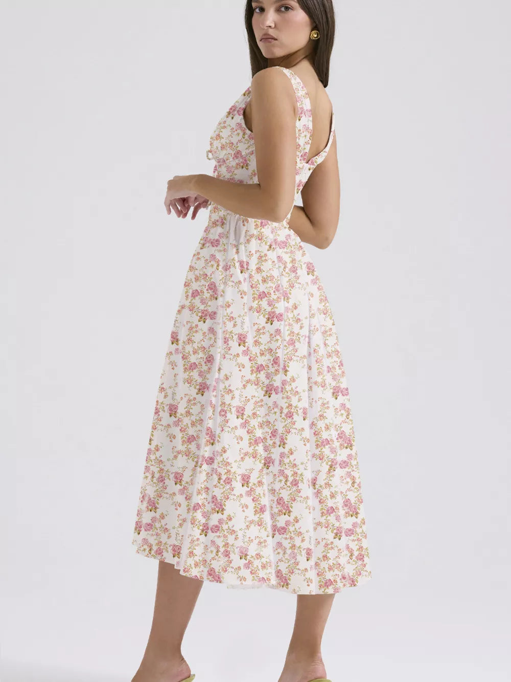 Floral print midi dress in cream with pink roses, V-neck, and a-line skirt.