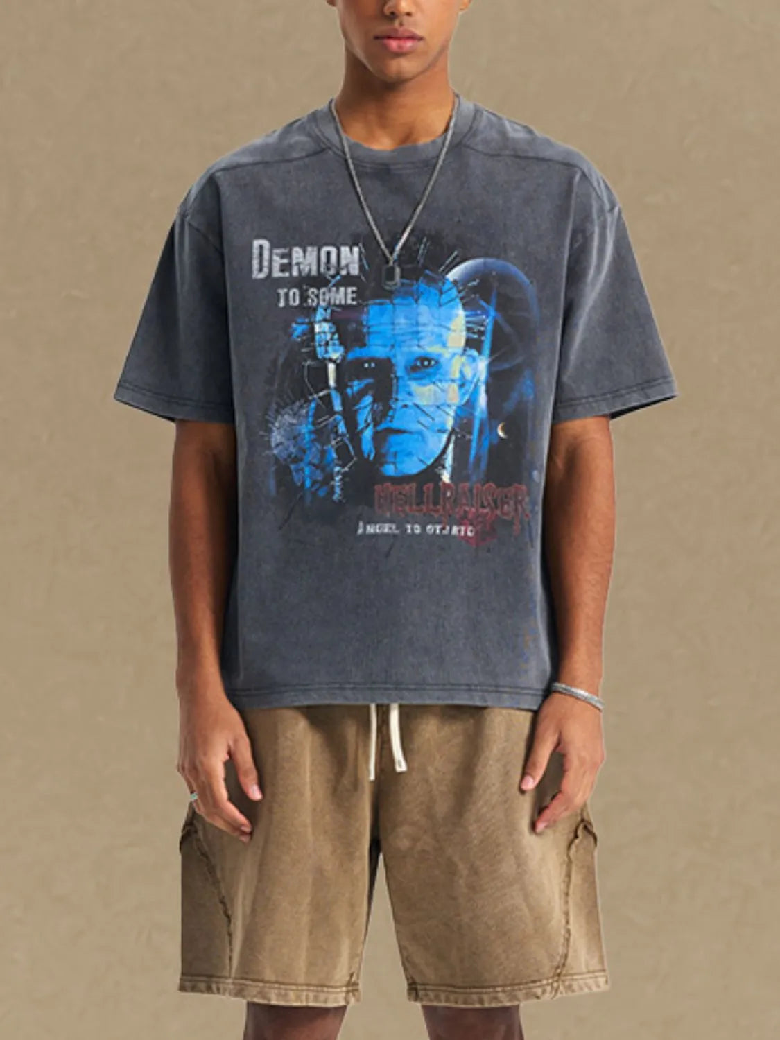 Dark gray relaxed fit tee with a graphic print of Pinhead from Hellraiser.