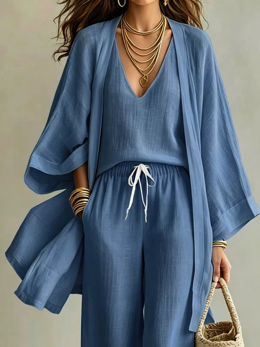 Blue linen blend kimono, v-neck top, and drawstring wide-leg pants set.