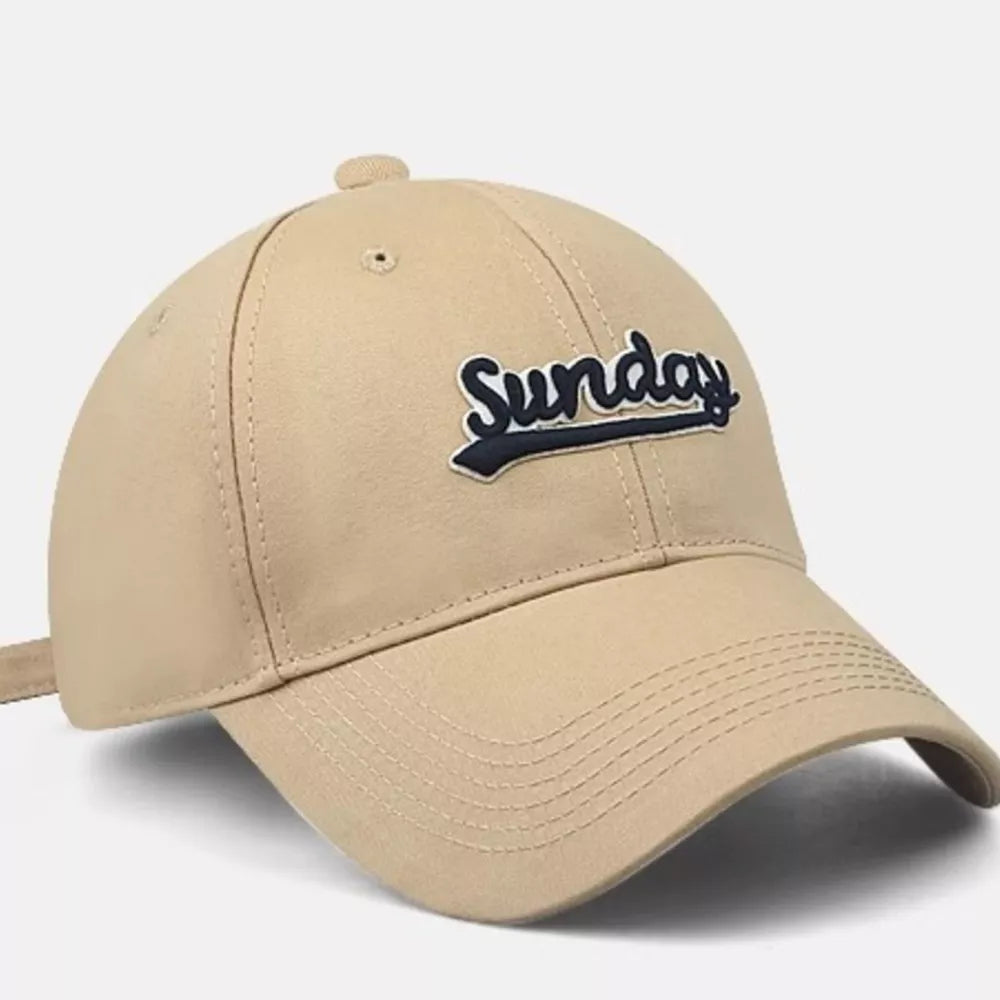 Tan baseball cap with embroidered navy blue "Sunday" text and adjustable strap