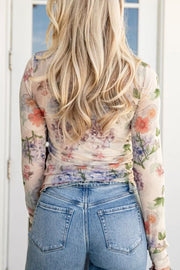 Floral sheer long sleeve maternity shirt with ruched sides.