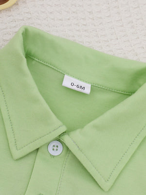 Light green cotton polo shirt with white button and size tag