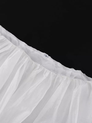 White crinoline petticoat with ruffled hem and elastic waistband.