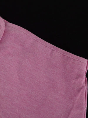Pink polo shirt with textured fabric and a classic collar.