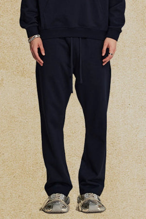 Navy relaxed fit lounge joggers with drawstring waist and cuffed ankles.