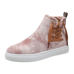 Blush pink tie-dye canvas zip-up sneaker booties with brown laces and frayed trim.