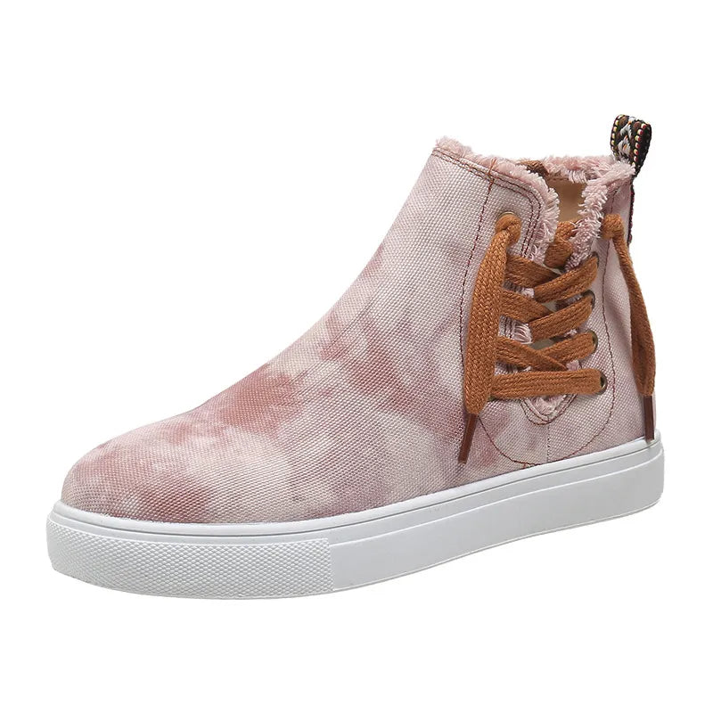 Blush pink tie-dye canvas zip-up sneaker booties with brown laces and frayed trim.
