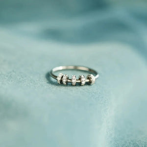 Sterling silver ring with five movable pavé-embellished beads.