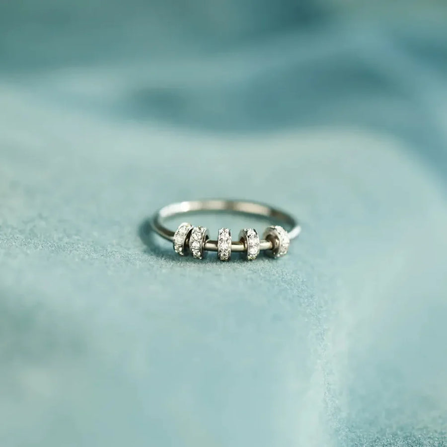 Sterling silver ring with five movable pavé-embellished beads.