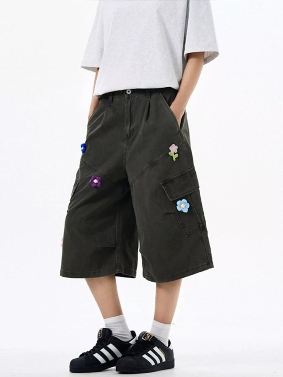 Dark Gray wide-leg cargo shorts with floral appliques and utility pockets.