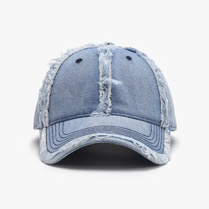Light wash denim baseball cap with distressed frayed edges and stitching detail