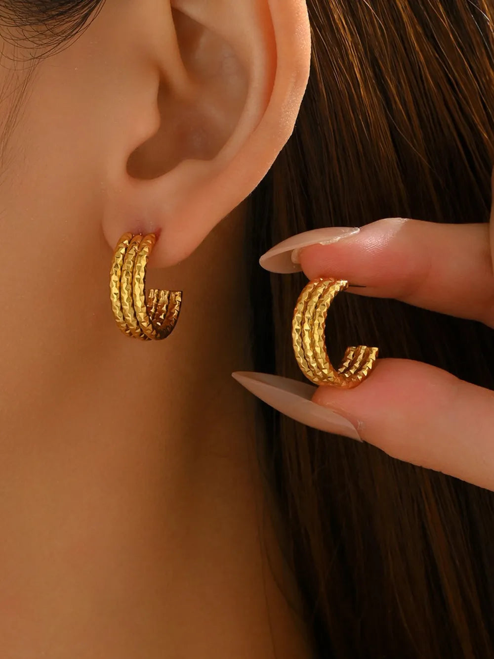gold earrings with geometric and n/a