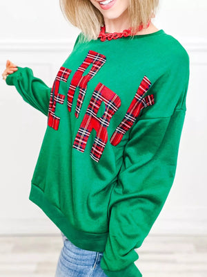 Green plaid letter graphic sweatshirt with crew neck and long sleeves.