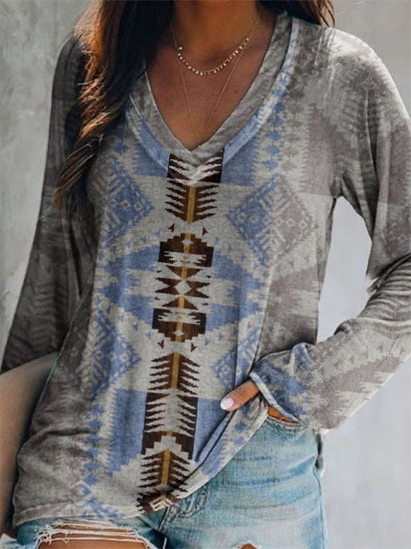Geometric V-neck long sleeve t-shirt in grey with blue and brown tribal print.